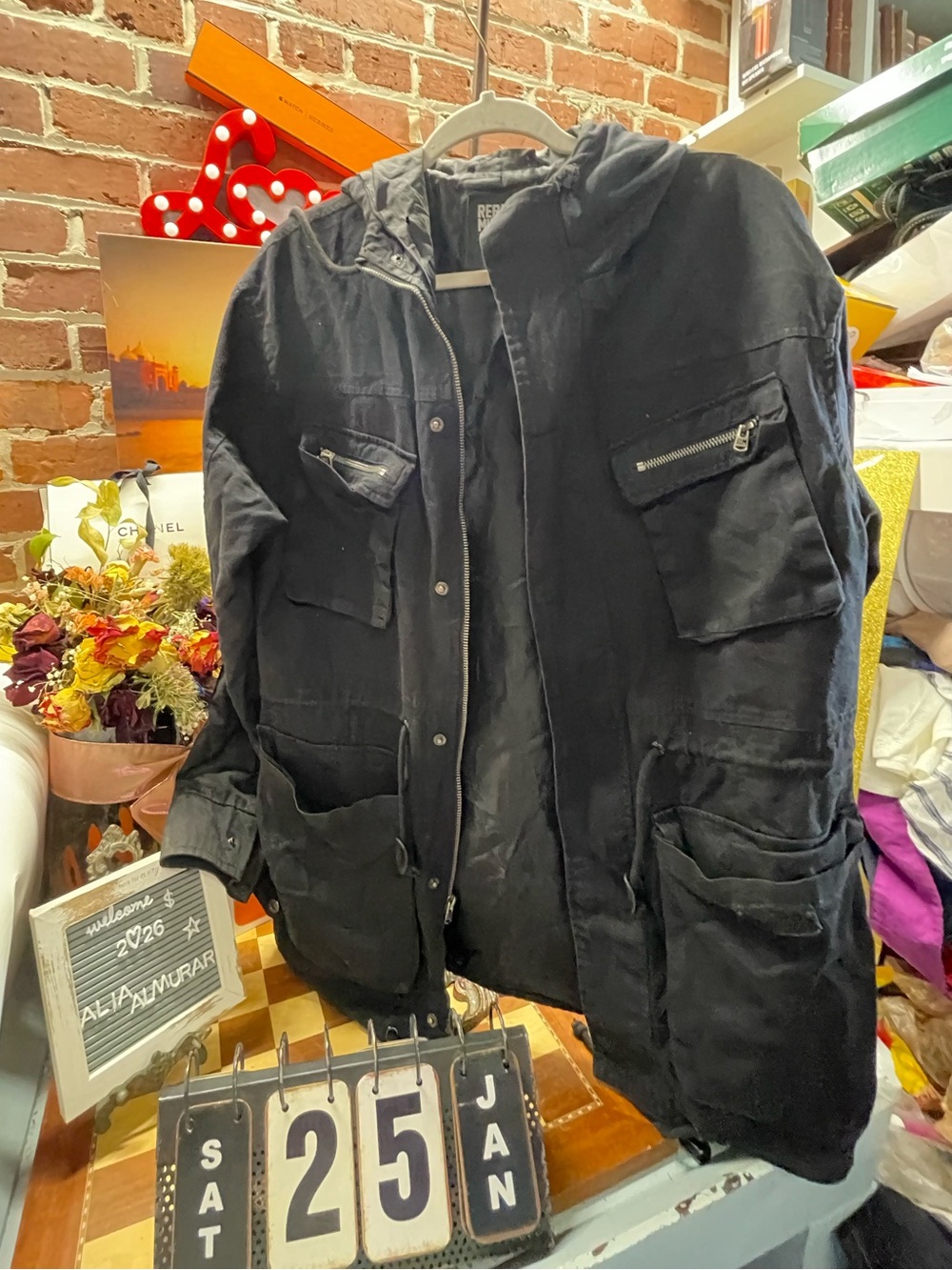 Rebel Minds features a zip-up front, multiple cargo pockets, and a detachable ho